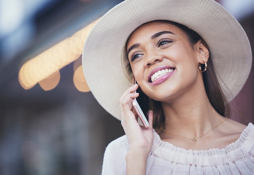 Woman, phone call and happy face while outdoor in city for communication, travel and 5g network. Yo